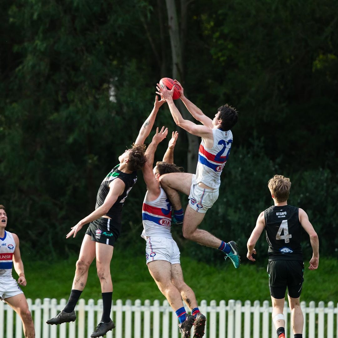 UNSW-Eastern Suburbs Bulldogs' captain-coach Dean Towers takes a towering mark over his UTS opponents