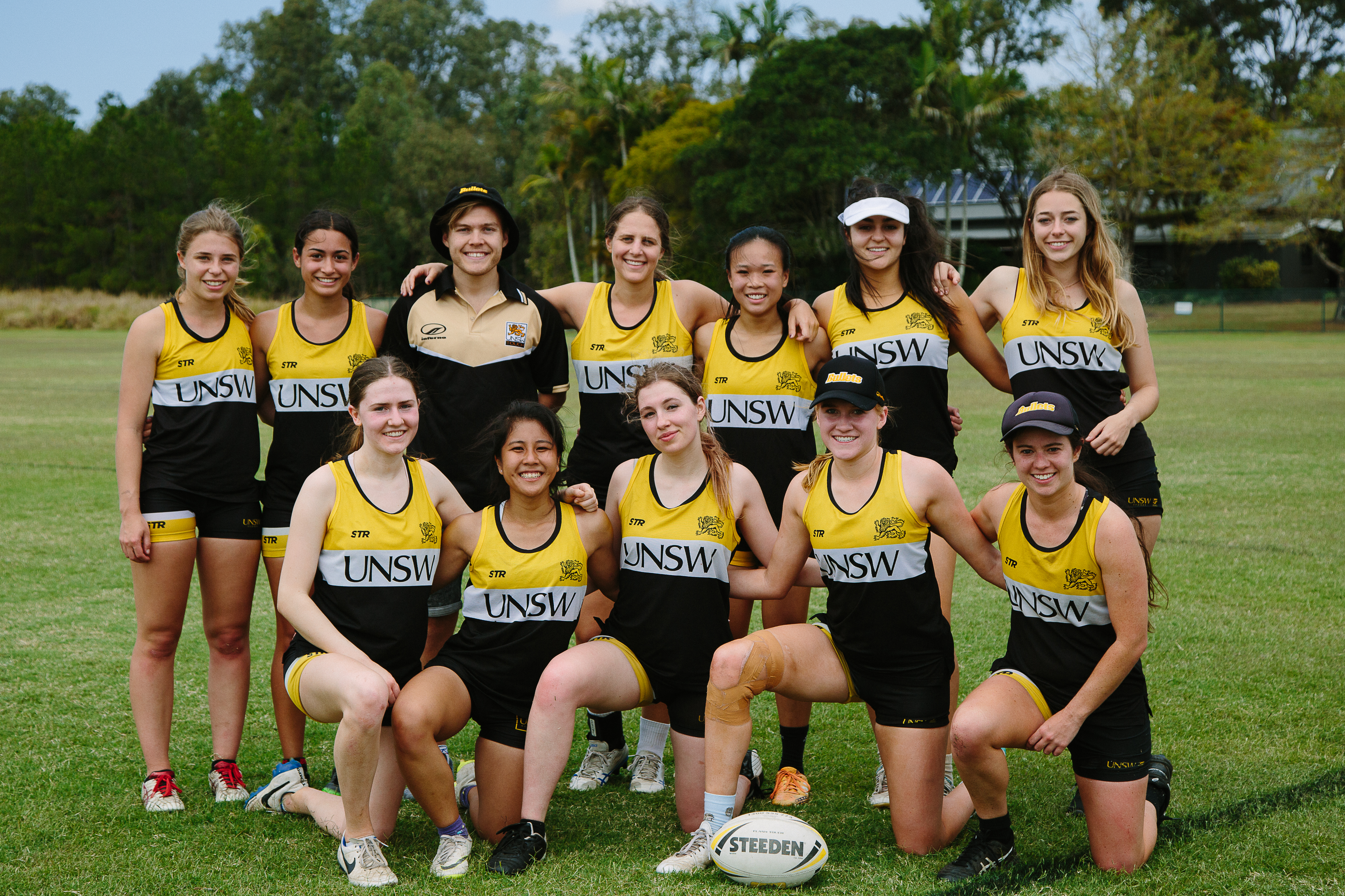 Women's touch football team posing for a photo