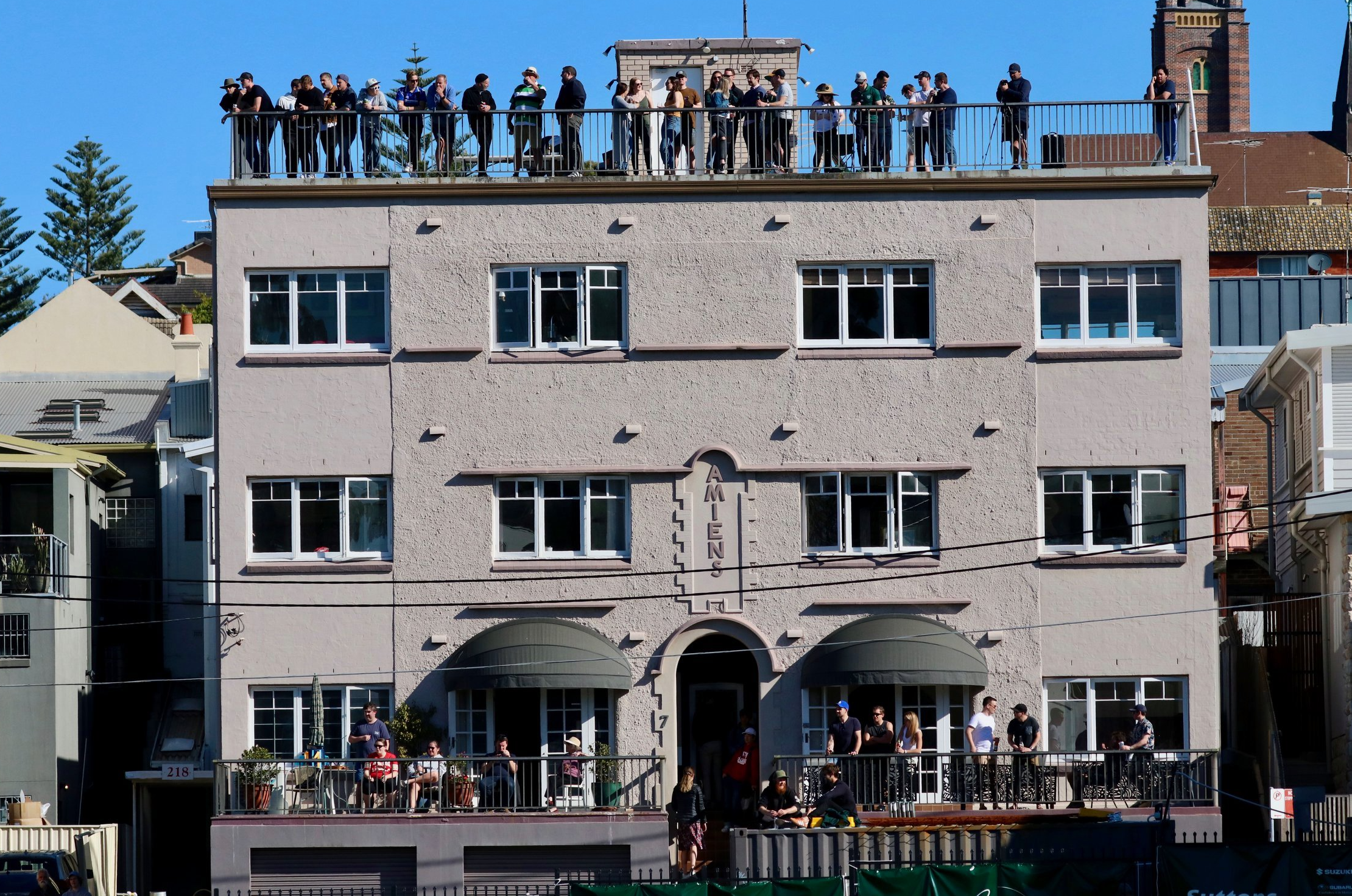 Spectators pack the balconies of nearby apartments