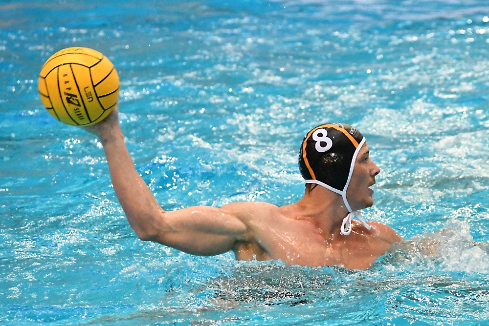 UNSW Wests Magpies player Andrew Ford prepares to pass during the gold medal match