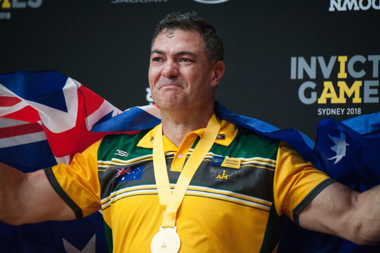 Ben Farinazzo with a gold medal and Australian flag