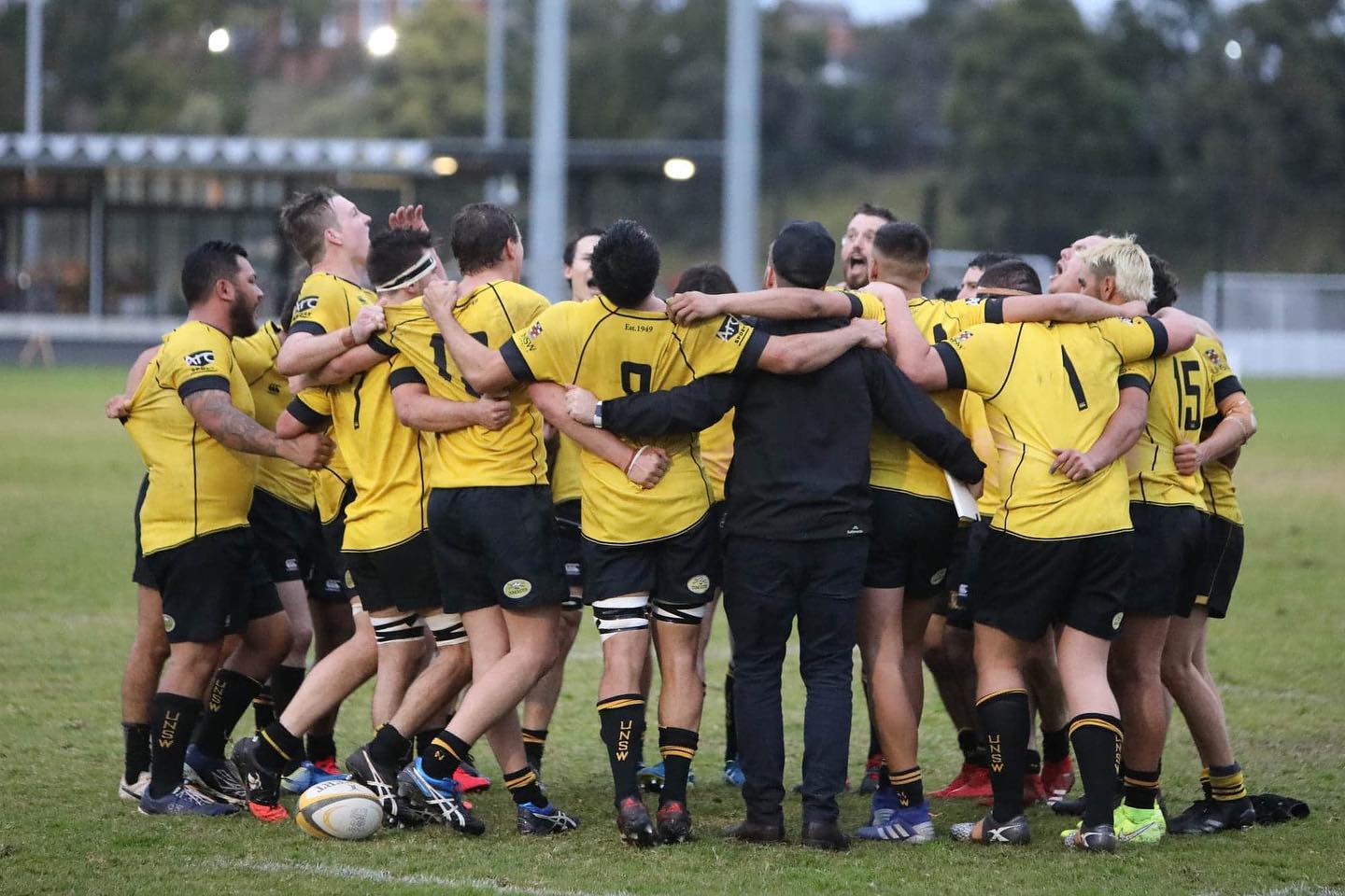 UNSW Rugby players in a huddle
