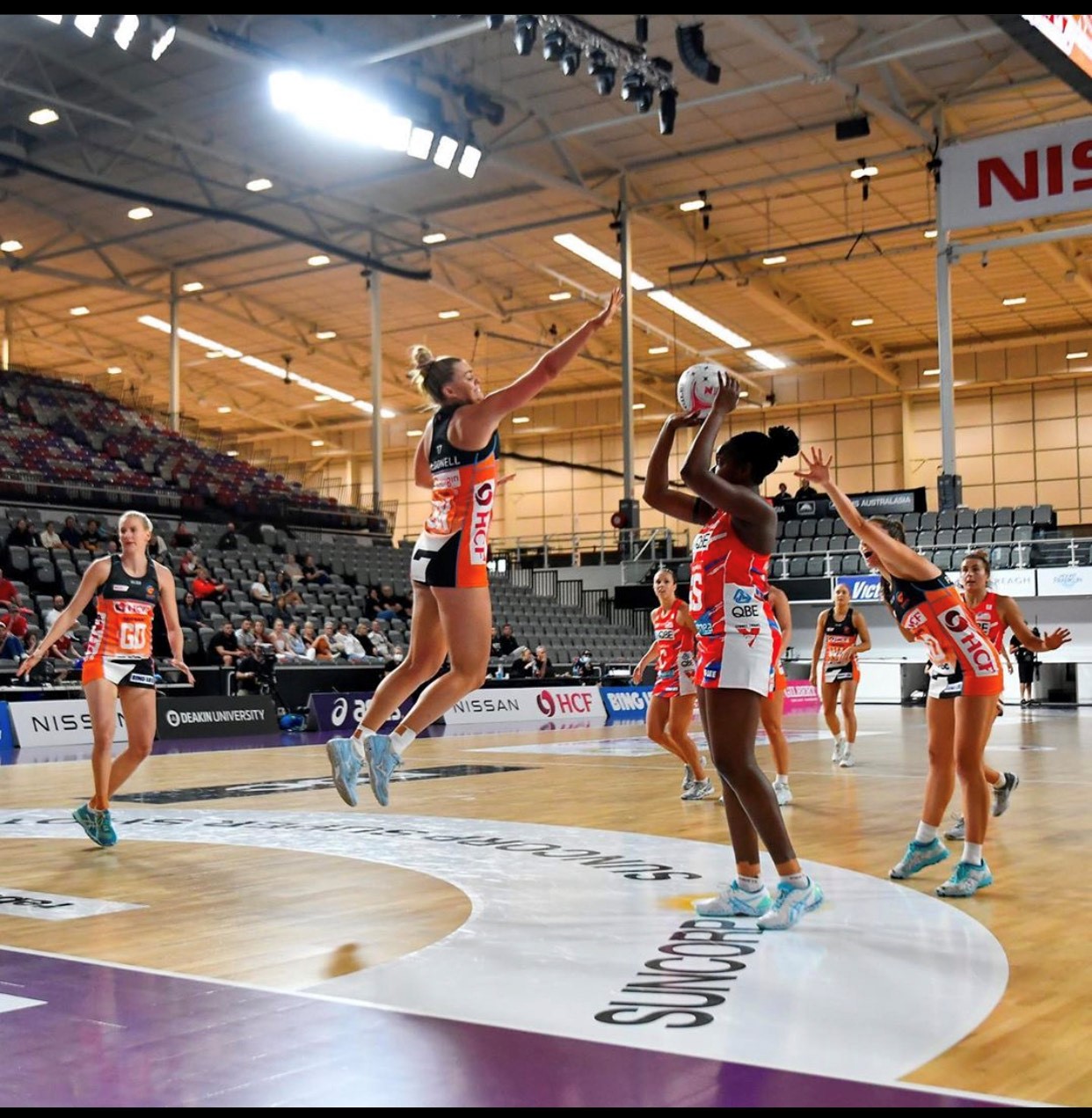 Tilly McDonell defending Sam Wallace in the Suncorp Super Netball