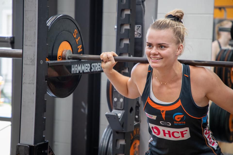 Matilda McDonell lifting weights