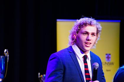 Ned Hanigan on stage at the UNSW Blues Awards